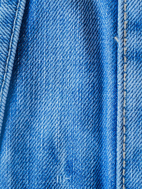 istock Texture of blue jeans fabric used and old 502641423