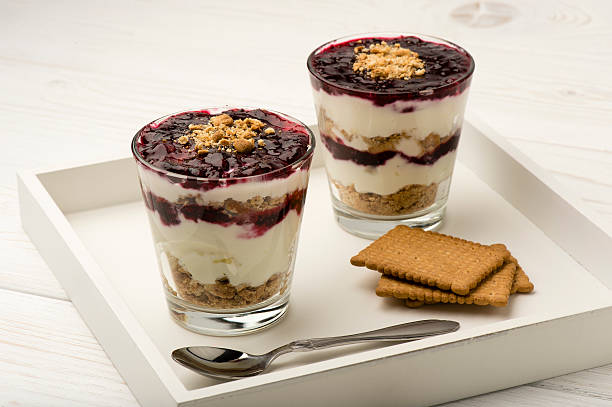 Healthy dessert with natural yogurt, full grain biscuits and jam.