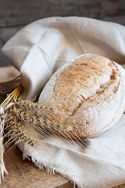 istock Freshly baked homemade bread on a wooden table 502641904