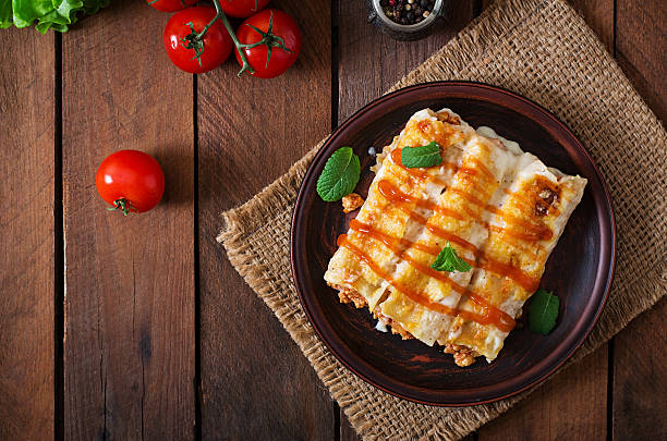 Meat cannelloni sauce bechamel. Top view Meat cannelloni sauce bechamel. Top view enchilada stock pictures, royalty-free photos & images