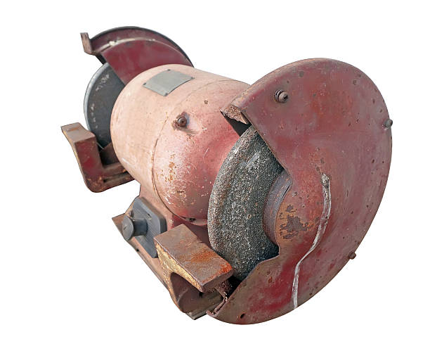 istock Close up a old bench grinder on white background 502642974