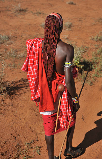 istock Masai warrior with traditional long hair walking 502643269