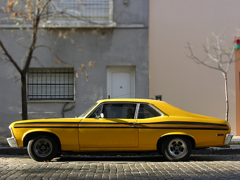 Side view of vintage muscle car from the 70s parked in street in Buenos Aires, Argentina