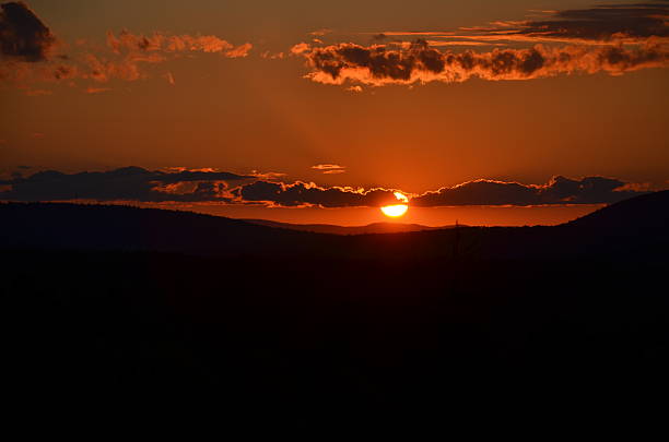istock summer sun set in New Hampshire 502643351