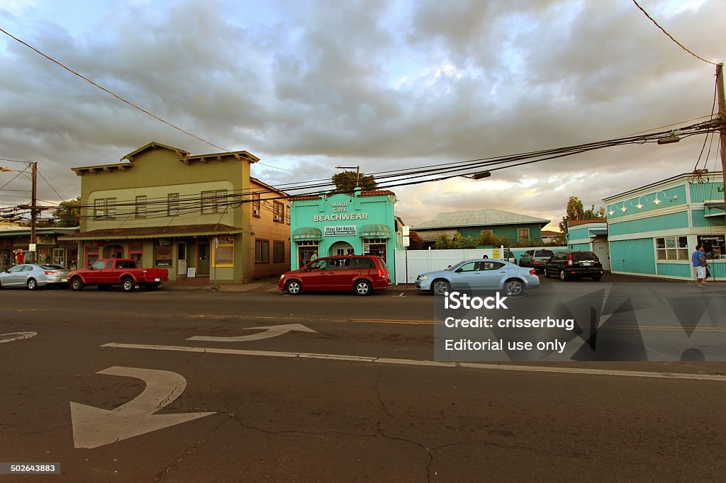 Downtown Paia, Maui Maui, Hawaii, USA - July 20, 2013: View of people and shops on a downtown street of Paia at dusk. Paia is home to several restaurants, art galleries, surf shops and other tourist-oriented businesses. Maui Stock Photo