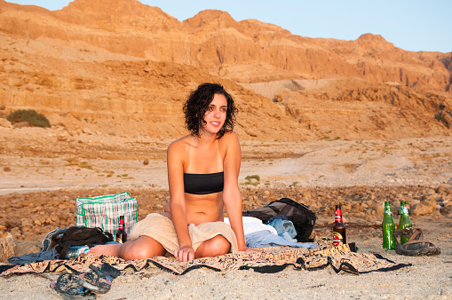 portrait attractive mid adult model woman looking at camera in the valley of the moon in san pedro de atacama