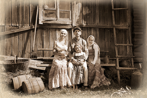 Vintage styled family portrait. Monochrome, grunge textures, intentional styled to the 1900's.
