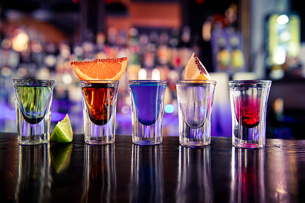 Shots cocktails  Shot Glasses with colored alcohol shot glass stock pictures, royalty-free photos & images