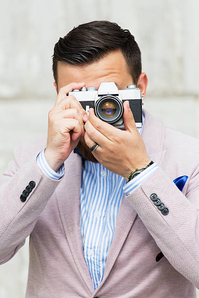 istock Men taking photo on film camera 502645485