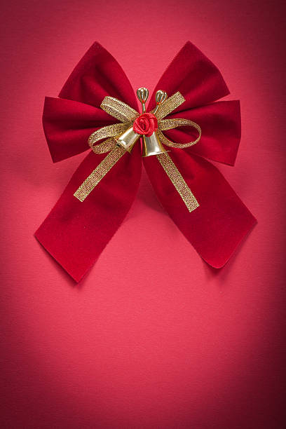 istock Christmas knot on red background holidays concept 502645754