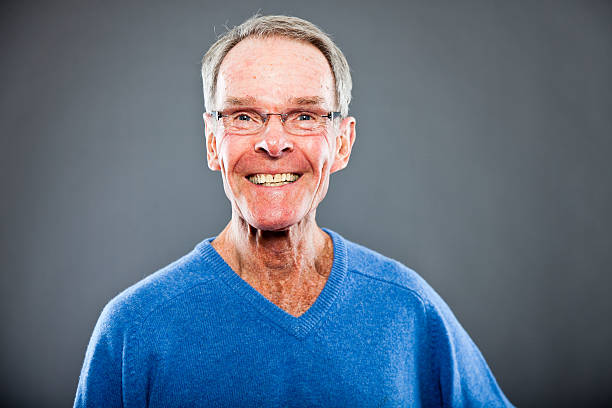 istock Expressive good looking senior man against grey wall. 502645807