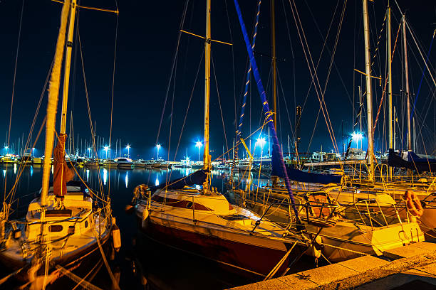 istock boats in Alghero seaport at night 502646400