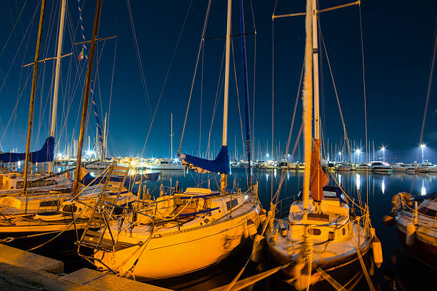istock boats in Alghero harbor at night 502647260