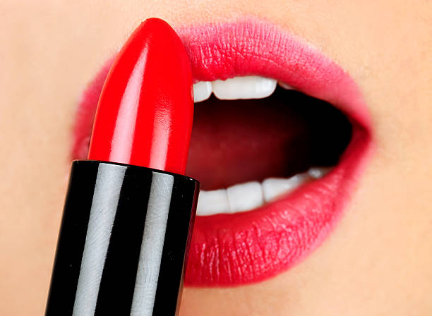 istock Woman applying lipstick 502647763