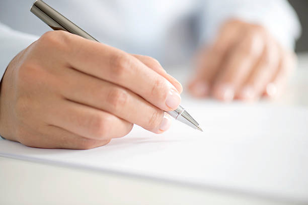 istock Woman Signing Contract Paper 502659484