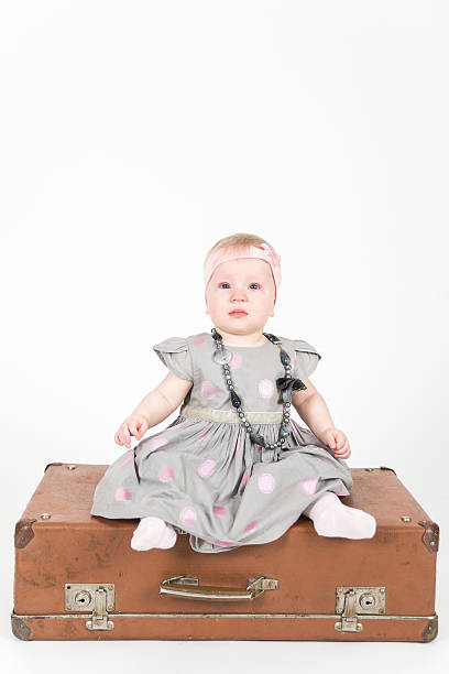 istock Little girl with the suitcase on the white background 502660310