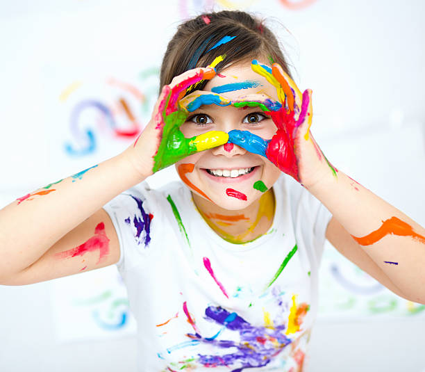 istock Cute girl playing with paints 502660810
