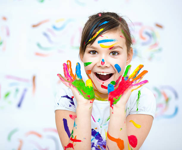 istock Cute girl playing with paints 502661234