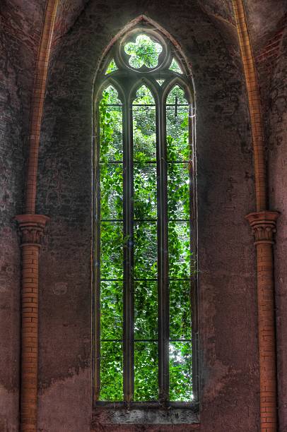 istock Grown decrepit old church window 502661263