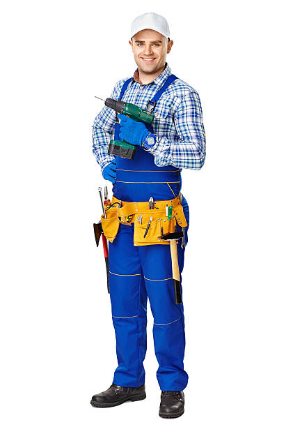 молодые строительный рабочий с электрическим сверло - screwdriver isolated blue work tool стоковые фото и изображения