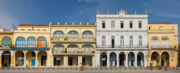 Havana, Cuba - August 6, 2013: Row of historic buildings with colorful facades at the Plaza Vieja in Old Havana.