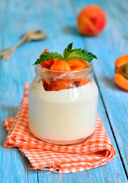 istock Greek yogurt with apricots in the jar. 502662297
