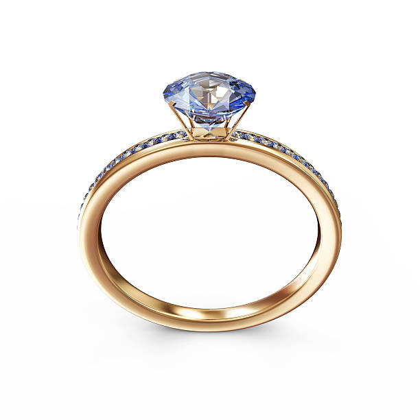 istock Golden Wedding Ring with Blue Diamonds isolated on white background 502662453