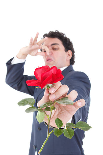 istock man throws a rose and gives it to the camera 502662833