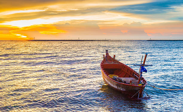 Boat at Sunset Seascape stock photo