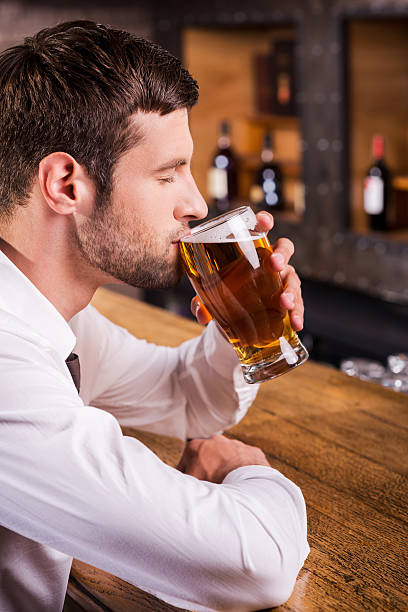 istock Enjoying his favorite lager. 502662907