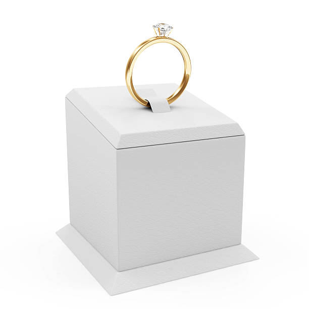 istock Golden Wedding Ring with Diamonds on Presentation Stand 502663459