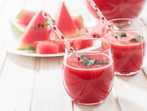 Watermelon refreshment Fresh watermelon juice in the glass.Selective focus on the front glass watermelon juice stock pictures, royalty-free photos & images
