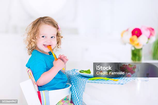 Little Happy Girl Eating Salad For Lunch Stock Photo - Download Image Now - Healthy Lifestyle, Blue, Breakfast