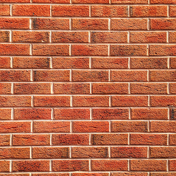fond de mur de briques sans couture britannique - seamless brick repetition pattern photos et images de collection