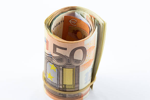 istock Fifty Euro rolled up on white background 502665780
