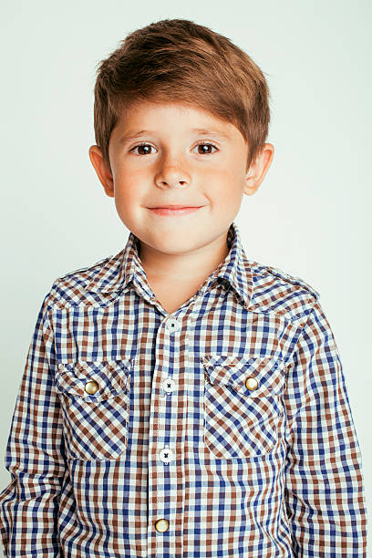 istock little cute boy on white background gesture smiling close up 502665798