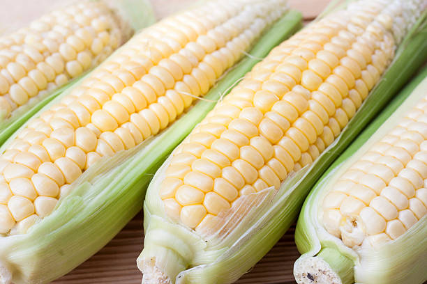 istock Fresh corn on the wooden table, selective focus 502666250