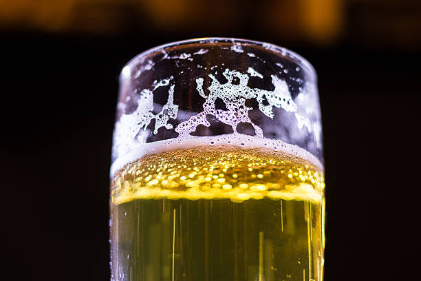 Beer with bright light rays through the glass