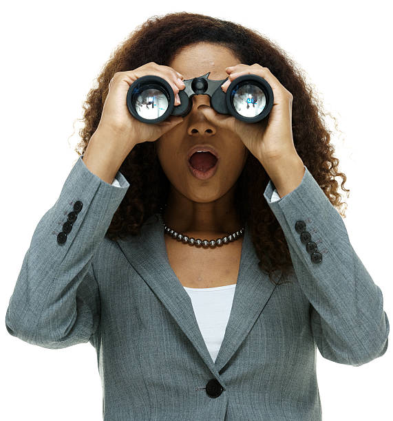 istock Businesswoman with binoculars 502666439