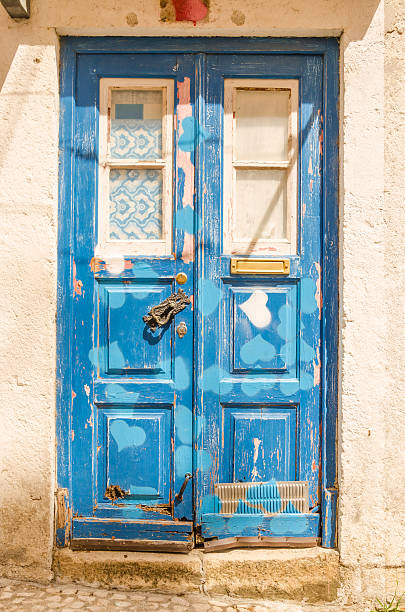 Blue wooden door against the stone wall