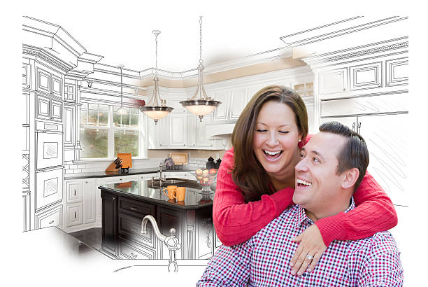 istock Laughing Couple With Kitchen Design Drawing and Photo Behind 502667612