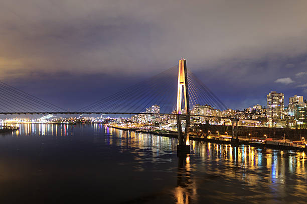 Night view of a city by a river Night view of a city by a river new westminster stock pictures, royalty-free photos & images