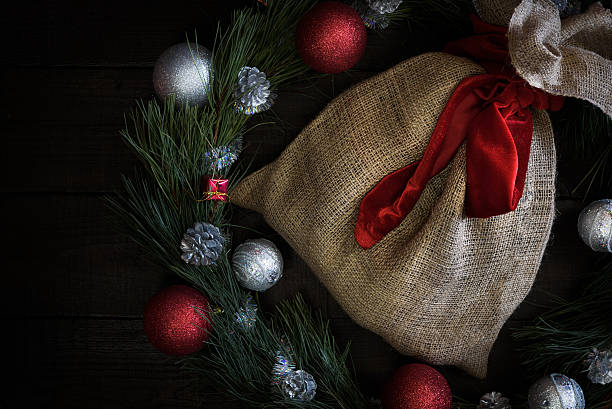 istock Christmas gift bag with red ribbon 502669050