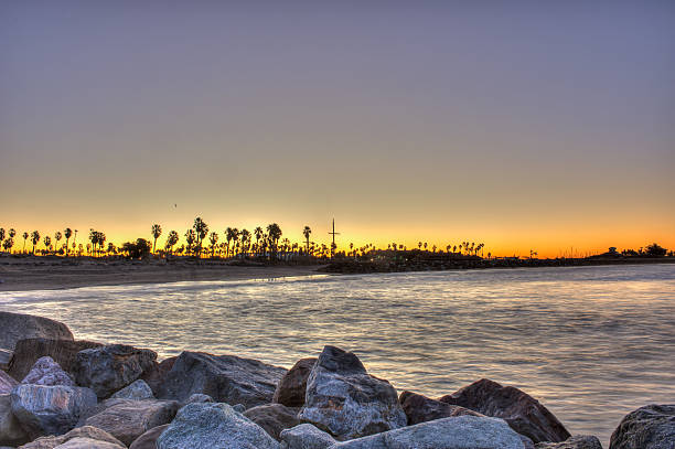 istock Morning sun illuminating water under jetty. 502670240