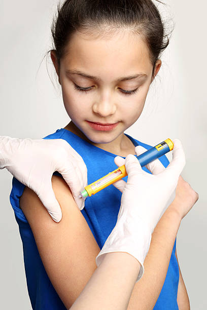 Diabetes in children - an injection of insulin Girl with diabetes during the injections of insulin. hyperglycemia stock pictures, royalty-free photos & images