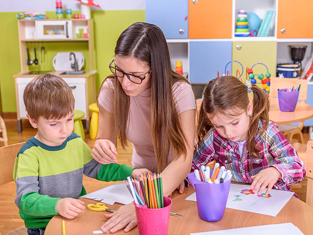istock preschool classroom teacher with kids 502670754