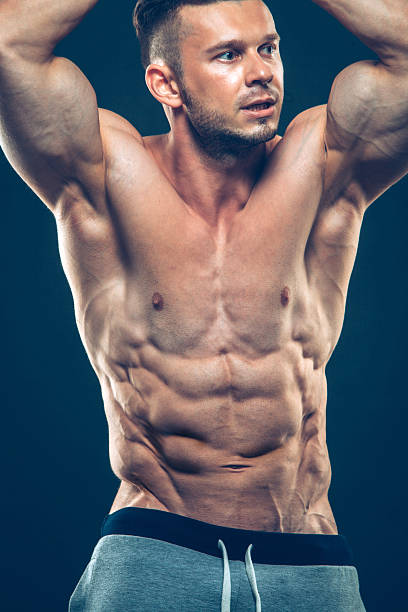 istock Strong Athletic Man Fitness Model Torso showing six pack abs 502673096