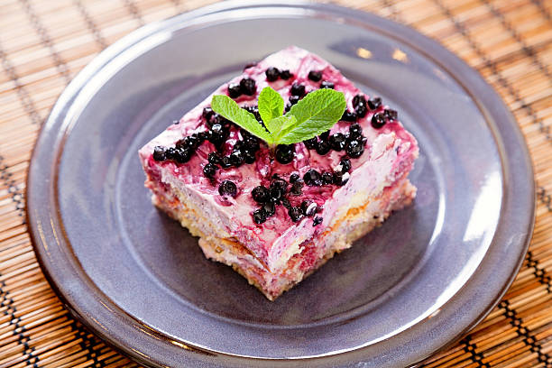 layered blackberry honey pie on white plate. Vertical image.