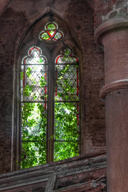 istock Old dilapidated church window 502684717