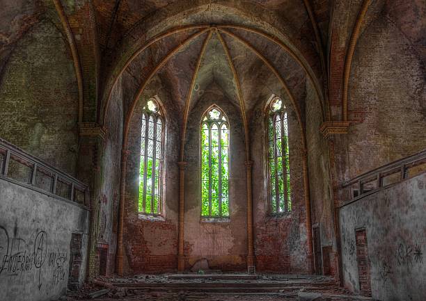 istock Old church window in an abandoned church 502684721